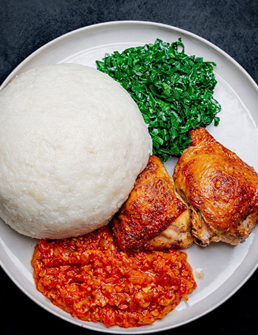 Family enjoying sadza